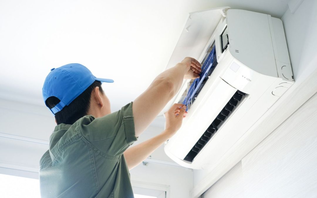 HVAC technician servicing a ductless mini split in Fremont